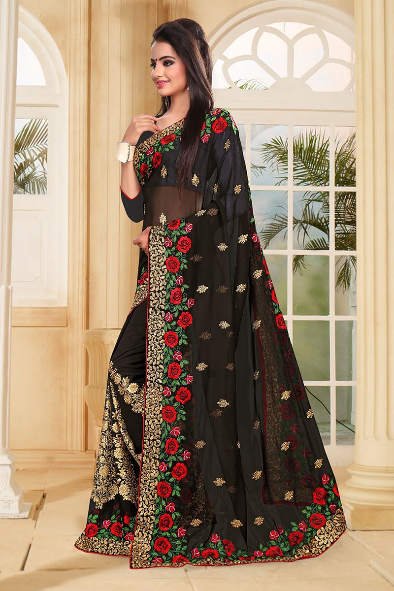 Bold black saree with red & green resham