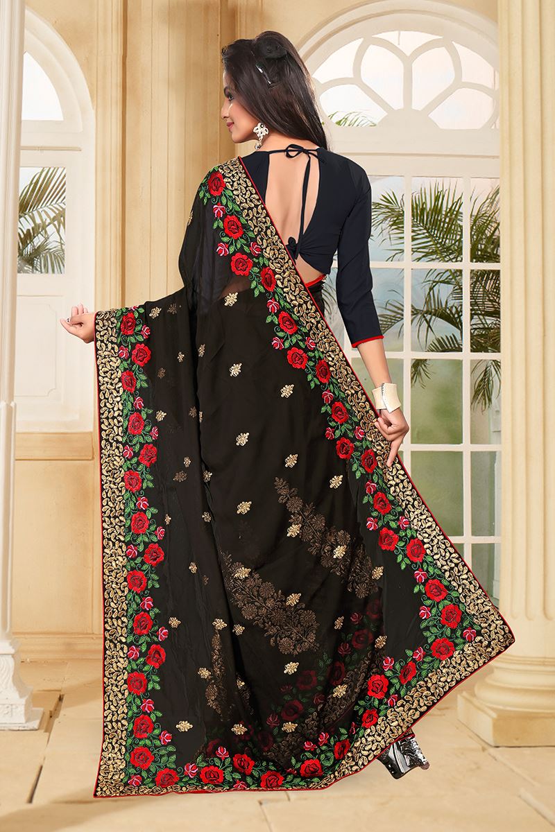 Bold black saree with red & green resham