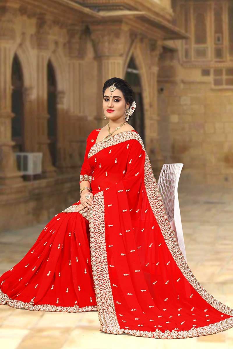 Striking red designer saree with motifs