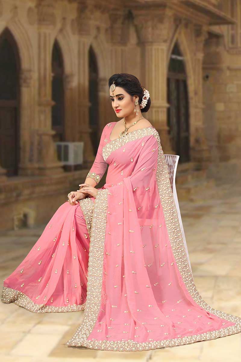Fashionable Peach designer saree with zari