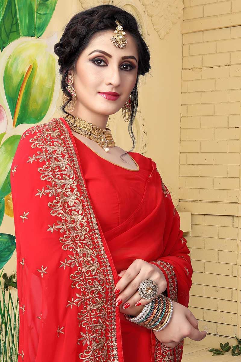 Relishing red designer saree with zari