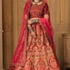 Marron Colored Embroidered Silk Lehenga Choli With Net Dupatta