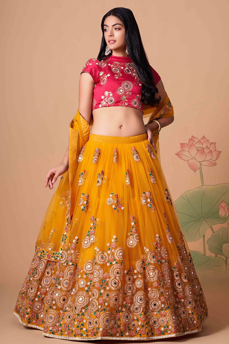 Exuberant Yellow and Rani Pink Colored Designer Lehenga